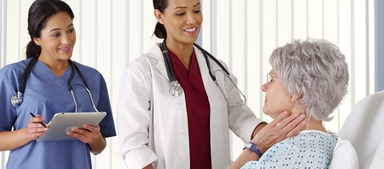 Doctor and nurse talking to patient